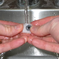 Cleaning of an artificial eye